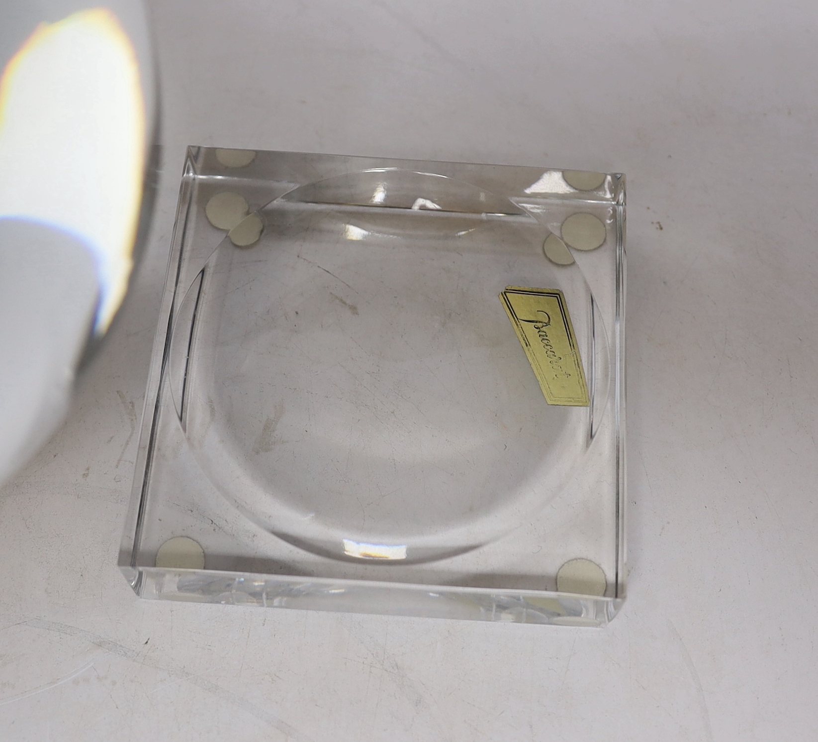 A large Baccarat glass crystal ball with two Baccarat stands, 16cm high